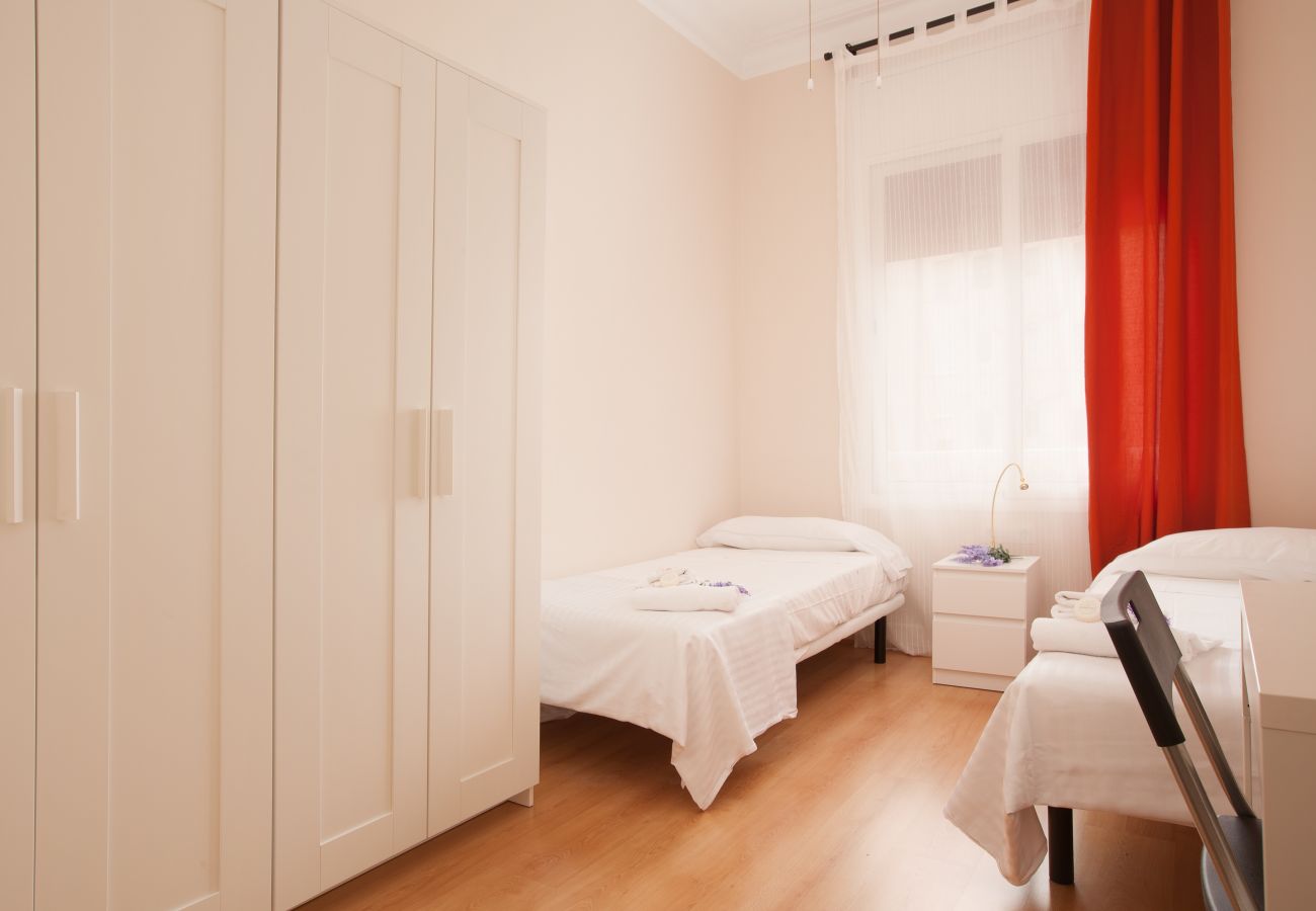 bedroom of apartment in Vallcarca with views to the mountains