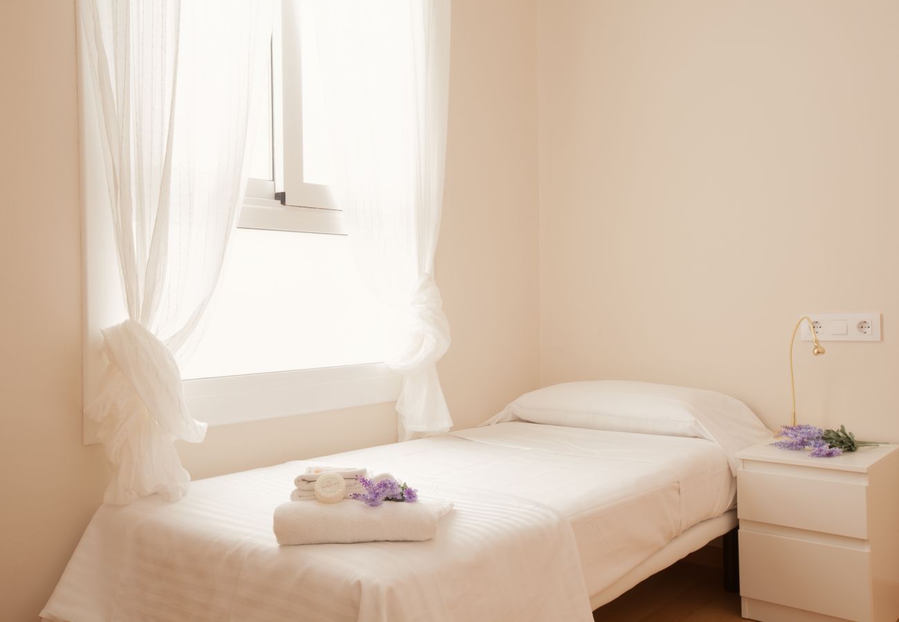 bedroom of apartment in Vallcarca with views to the mountains