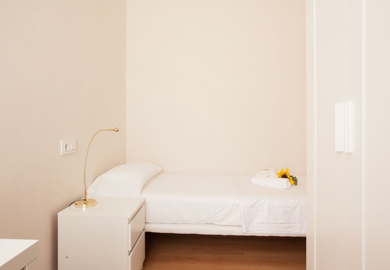 bedroom of apartment in Vallcarca with views to the mountains