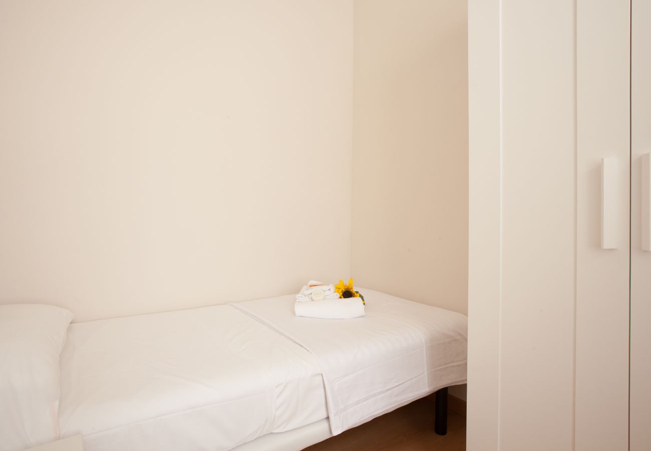 bedroom of apartment in Vallcarca with views to the mountains