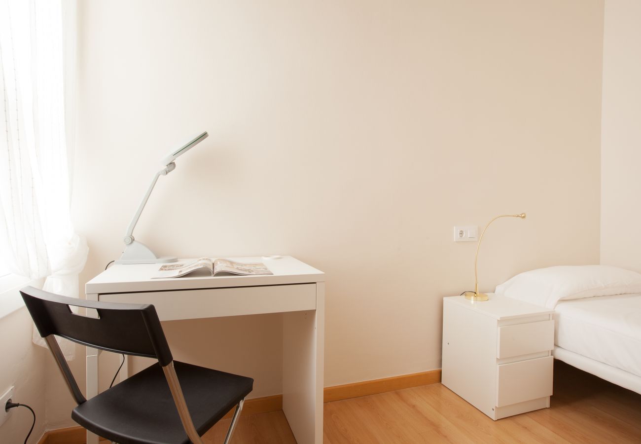 bedroom of apartment in Vallcarca with views to the mountains