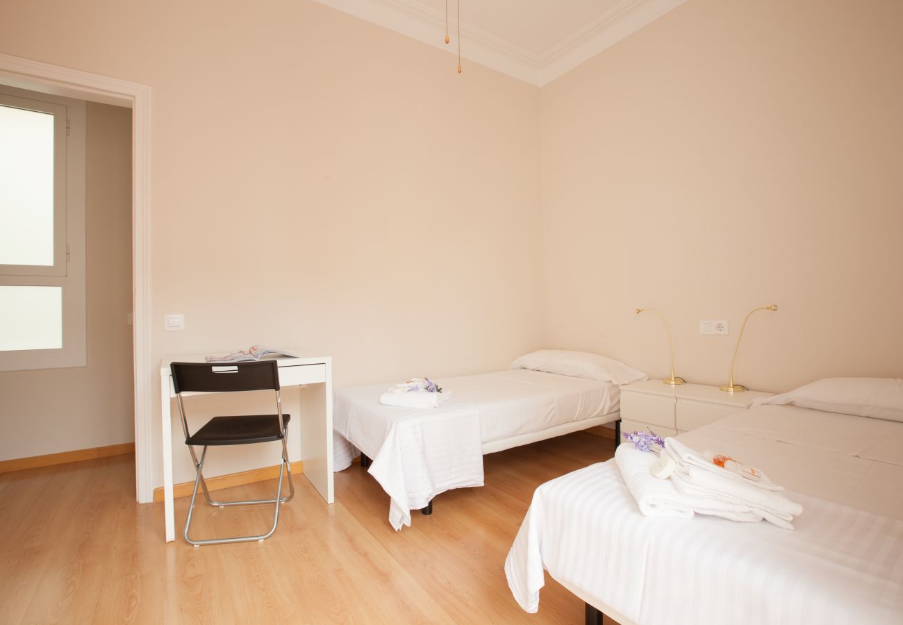 bedroom of apartment in Vallcarca with views to the mountains