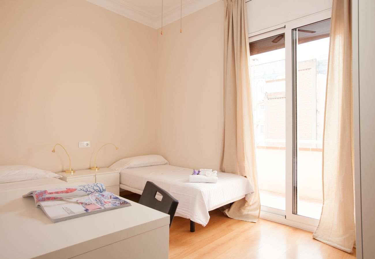 bedroom of apartment in Vallcarca with views to the mountains